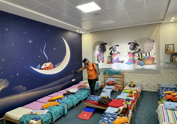 Best Control technician safely treating a children's nursery in Erbil